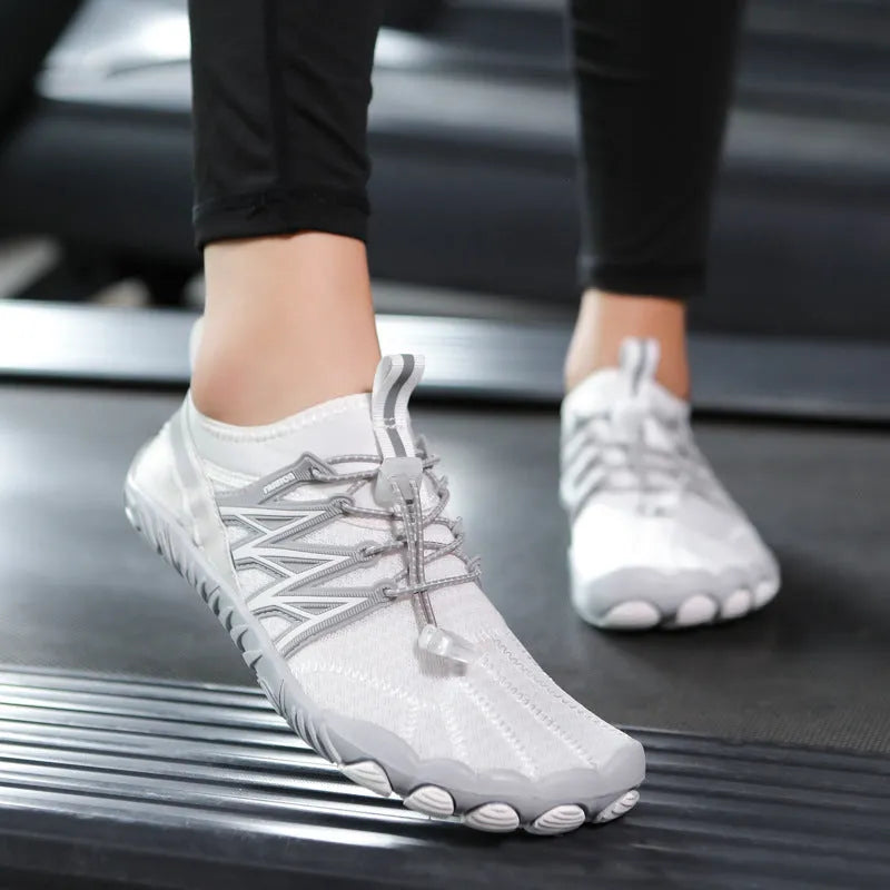 Indoor fitness training sneakers with non-slip rubber sole in various colours showing striped pattern and low top design