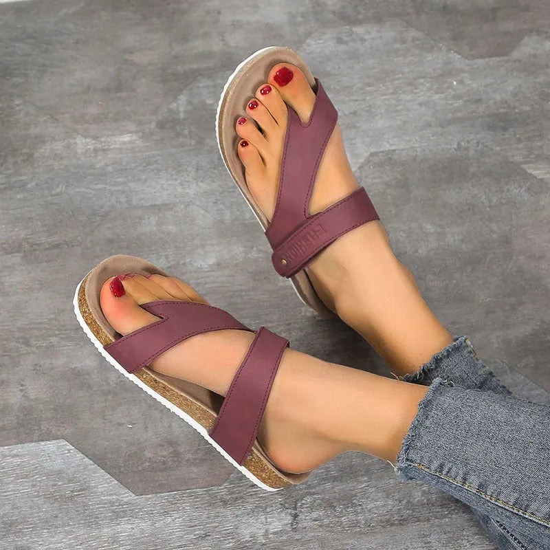 A pair of solid-colour flip-flops with a flat toe ring and thick foam sole.