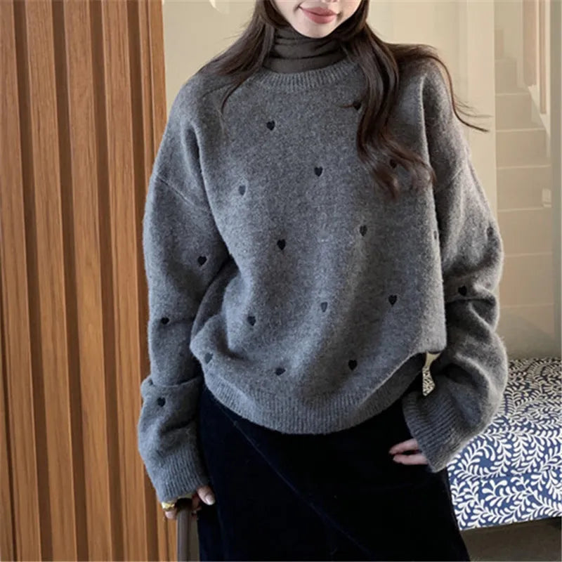 Women's acrylic pullover sweater with embroidery detail in milky white colour showing loose fit design