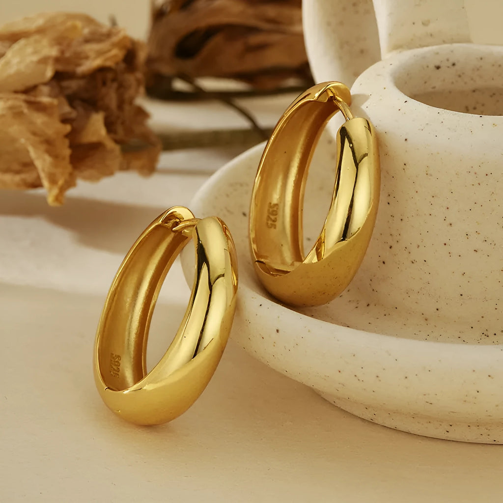 Pair of S925 sterling silver round hoop earrings with glossy electroplated finish in gold or white gold