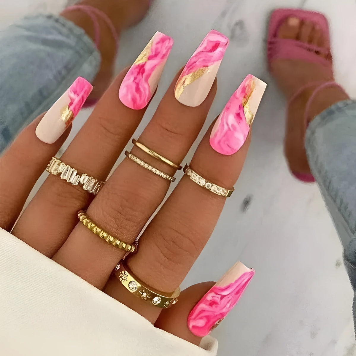 Wearable manicure set with 24 medium false nails in rose, tulip, leopard print, and XINGX patterns, plus glue.
