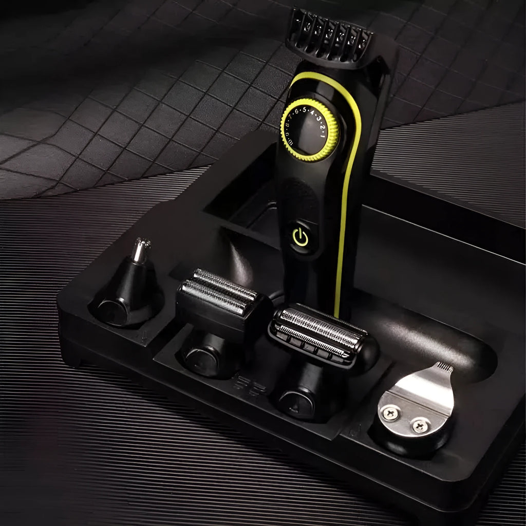 Black KM-696 rechargeable electric hair clipper set with stainless steel blade and cleaning accessories.