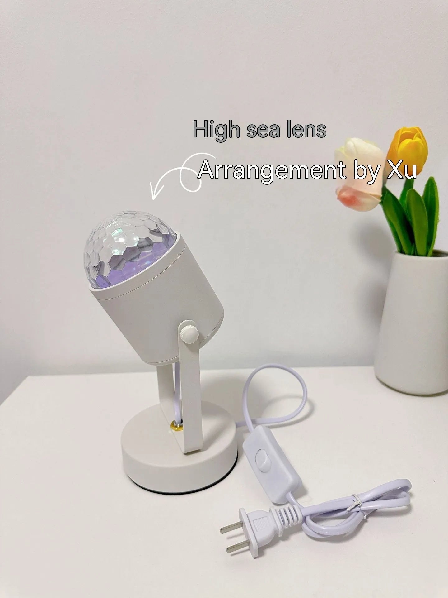 Dynamic water ripple ambience table lamp for ceiling or desktop use with metal holder.