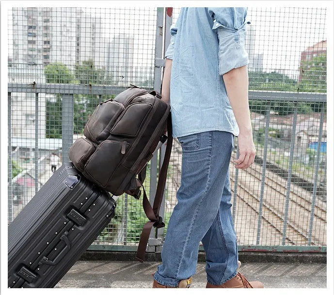 Dark brown genuine leather backpack for men with 17-inch laptop compartment and multiple internal organisers