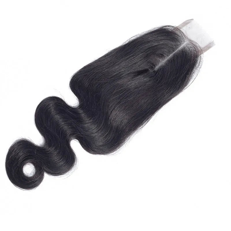 A straight, natural-coloured human hair wig displayed on a stand, showing its length and hand-woven cap construction.