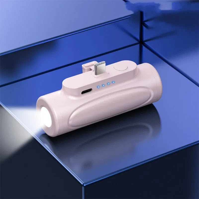 Black or pink power bank with integrated LED flashlight, 5000mAh capacity, 83mm length