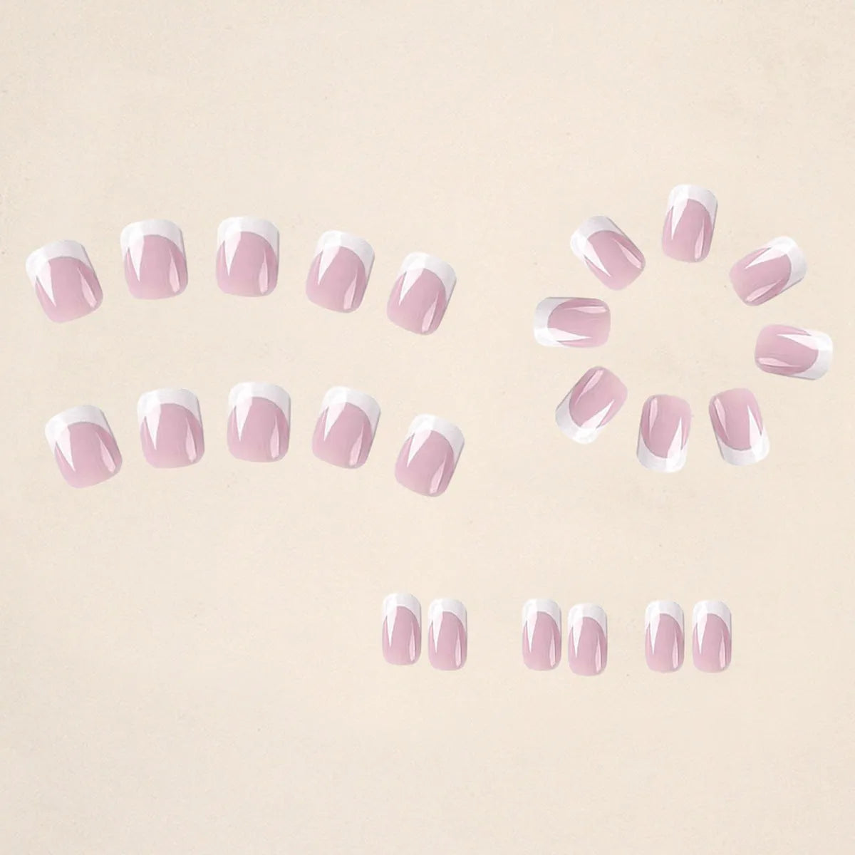 24 white square fake nails with a black and white plaid pattern arranged on a table.