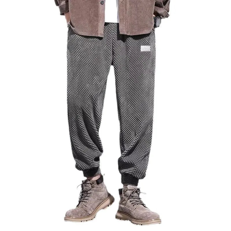Men's grey casual sweatpants with ankle tie detail showing straight-leg silhouette