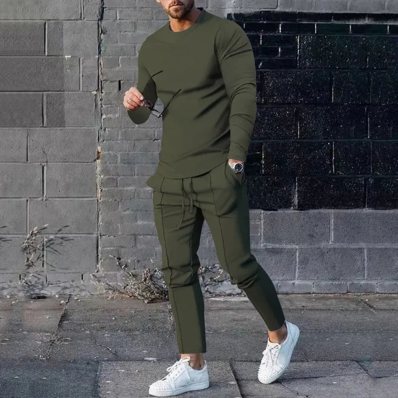Men's light grey two-piece casual suit with long sleeve T-shirt and trousers on a hanger.