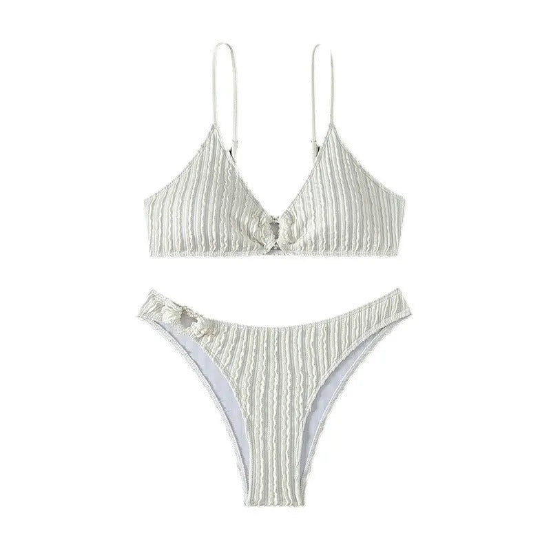 White women's V-neck swimsuit with sleeveless design and beach split styling
