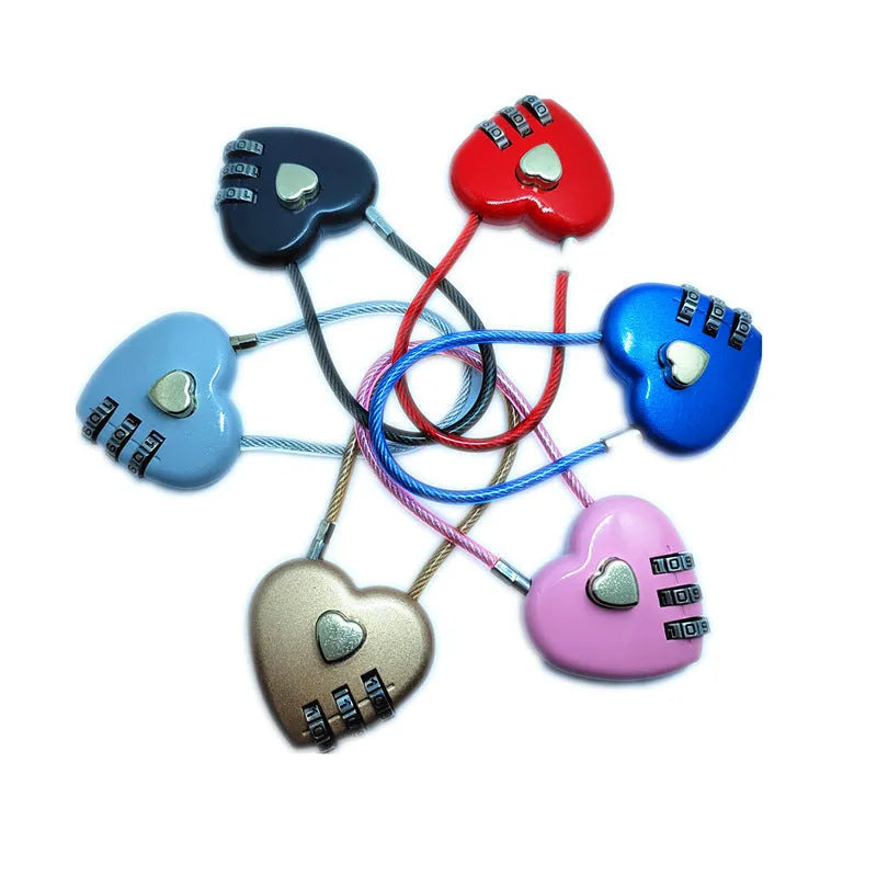 Heart-shaped wire rope lock in various colours with a steel cable, shown securing a bicycle helmet.