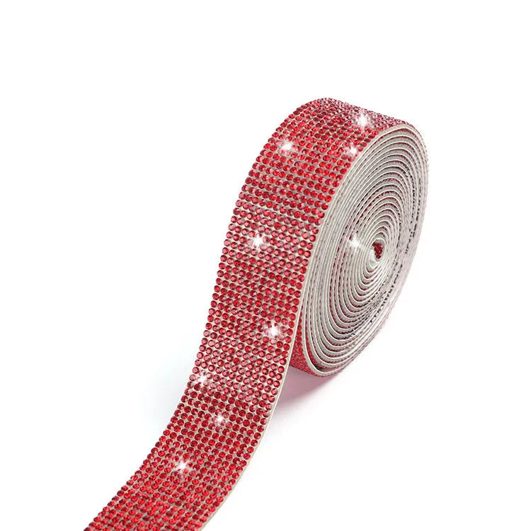 Close-up of a self-adhesive electroplated glass crystal strip on a roll for clothing decoration.
