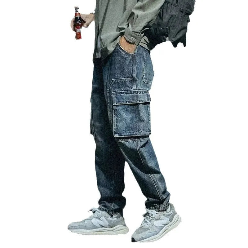 Blue men's loose-fit straight-leg casual trousers with a zip fly on a solid background