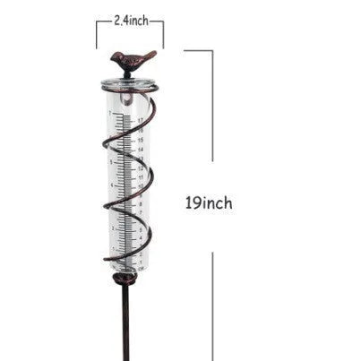 Cast iron hummingbird-shaped base holding glass rain measurement tube with 0-800ml scale