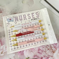 Five nurse-themed retractable ballpoint pens displayed together
