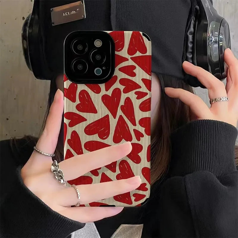 All-inclusive imitation leather phone case with full screen red love heart design for Apple iPhone.