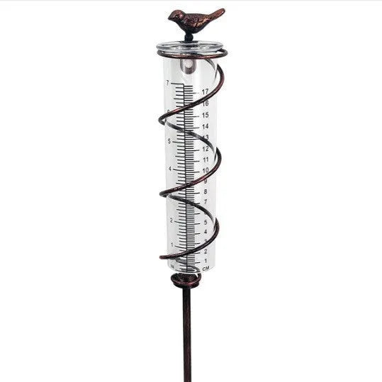 Cast iron hummingbird-shaped base holding glass rain measurement tube with 0-800ml scale