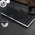Heijue AK33 82-key wired mechanical keyboard with metal body and backlighting on a desk