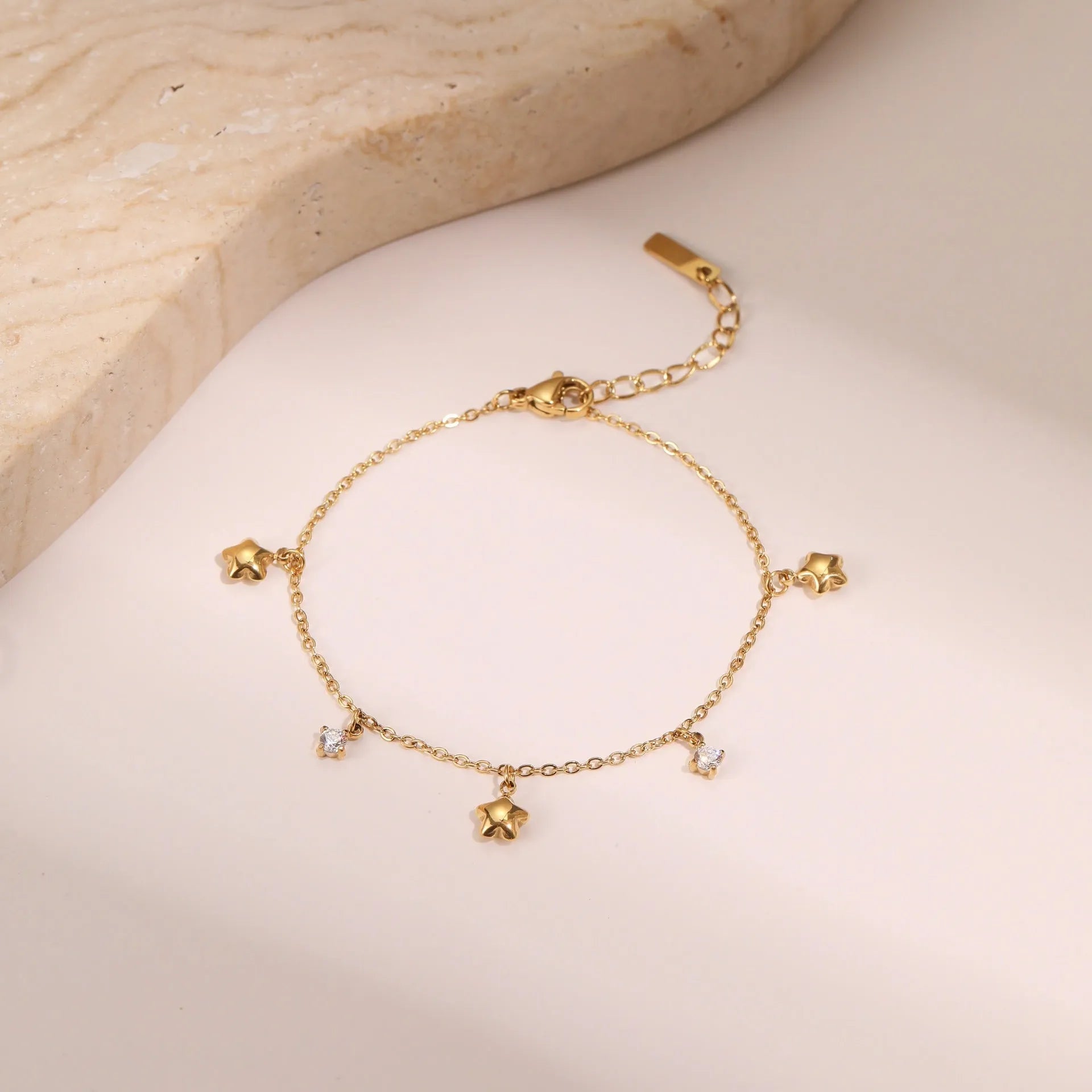 Women's titanium steel bracelet with gold plating and hexagonal star zircon pendant