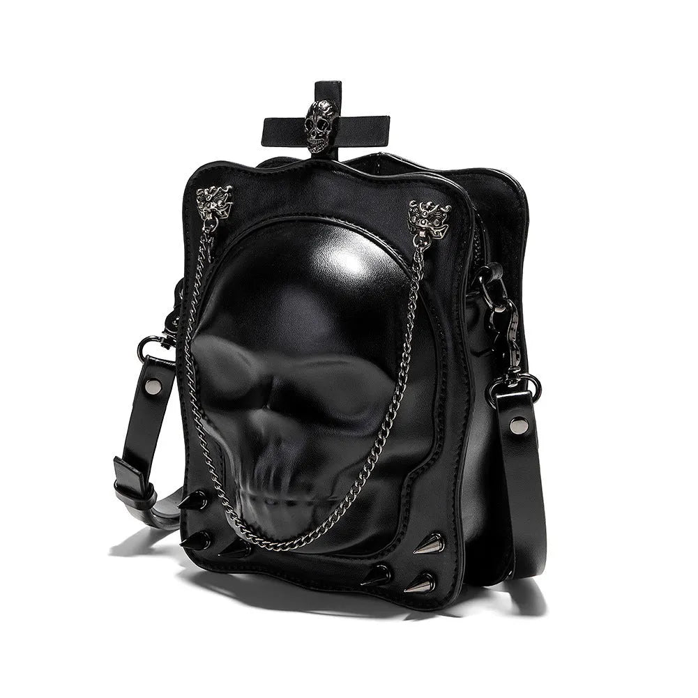 Black mini square shoulder bag with Gothic skull embossed design, chain strap, and zipper opening