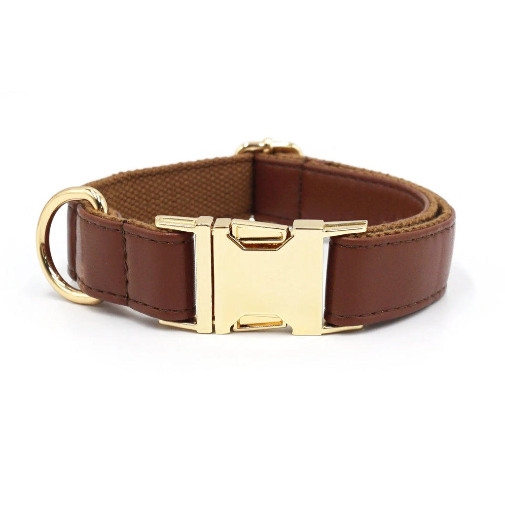 Solid colour leather dog collar shown in a selection of hues including caramel, dark blue and rose pink.