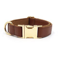 Solid colour leather dog collar shown in a selection of hues including caramel, dark blue and rose pink.
