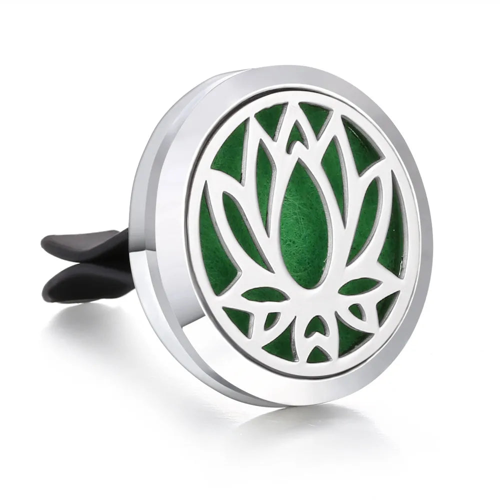 Round stainless steel car air vent perfume clip with polished finish, 30mm diameter, available in eleven steel colours and three patterns.