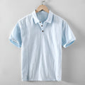 Men's loose-fit cotton linen casual shirt in a solid colour, shown on a hanger.