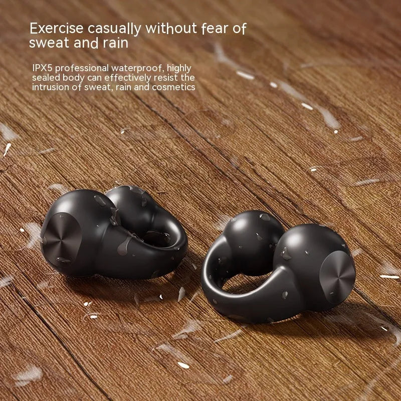 Clip-on wireless Bluetooth headset with digital display in black colour on a plain background
