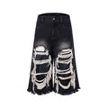 Black women's cropped wide-leg jeans with a ripped patch detail on the leg.