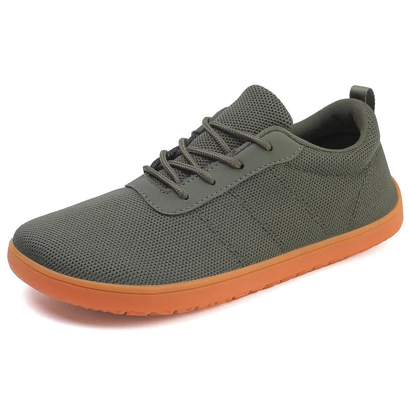 Men's black Flyknit walking shoes with wide round toe and flat non-slip rubber sole on a white background.