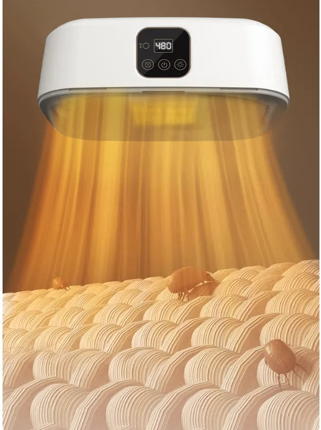 White cylindrical compact laundry drier with remote control on countertop