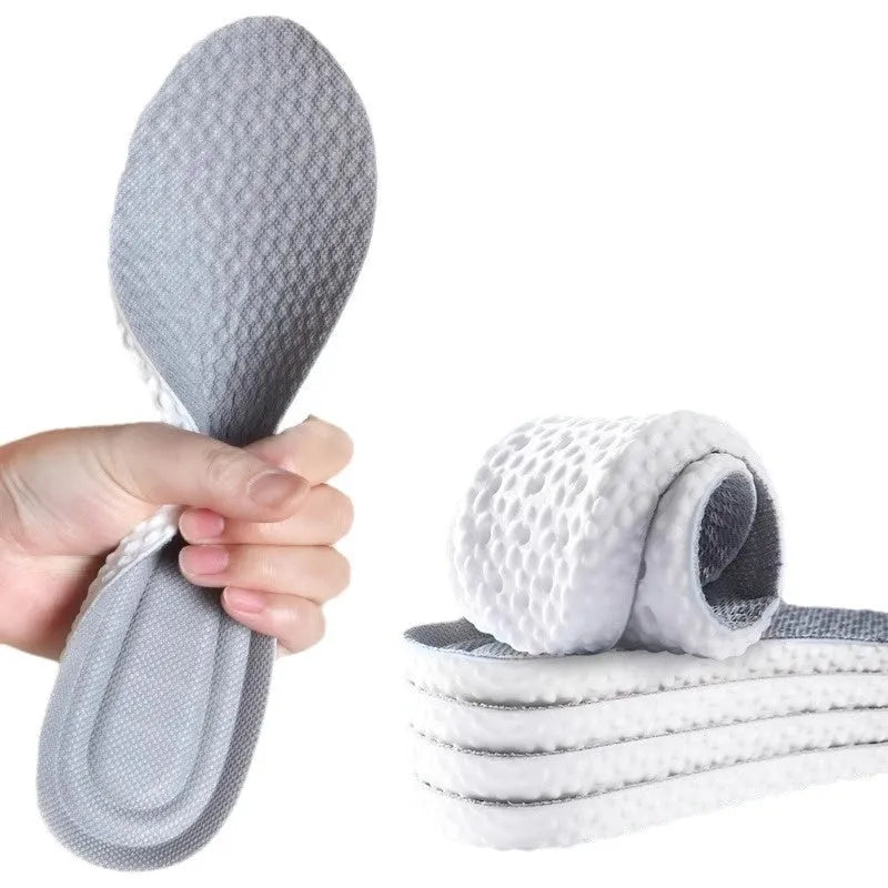 Breathable grey, black, and orange PU foam sports insoles with cut-to-fit sizing lines.