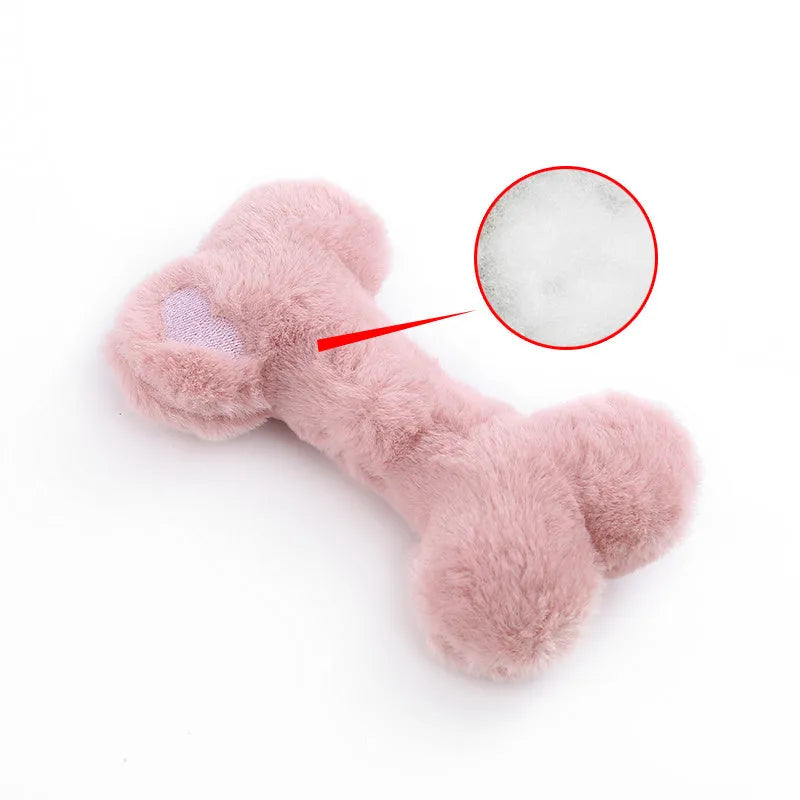 Blue Love Bone shaped plush dog toy with squeaker on a plain background.