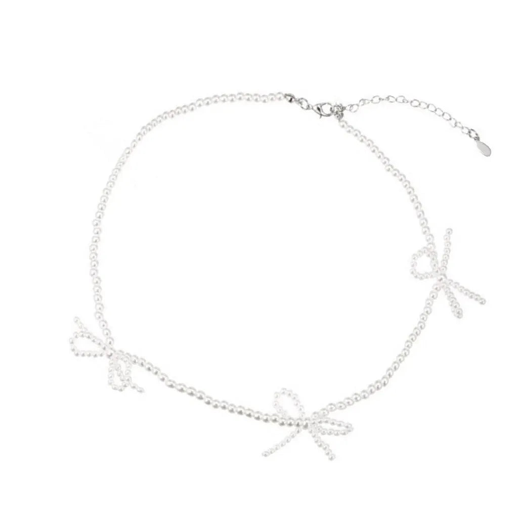 White imitation pearl necklace with bow-shaped pendant on adjustable 31-40 cm chain