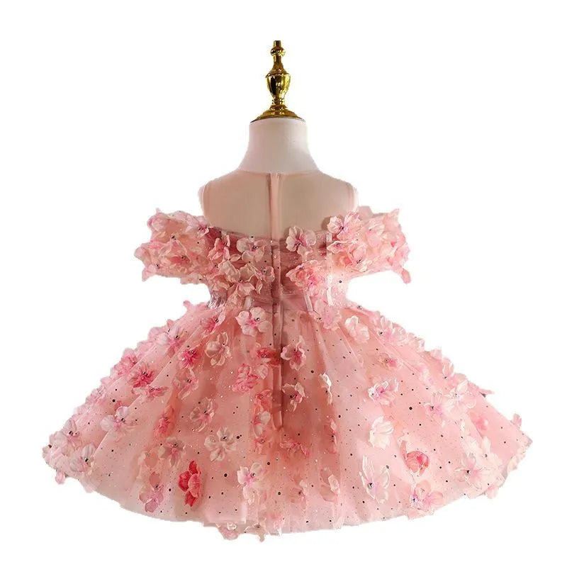 Girls pink polyester pettiskirt princess style dress on white background showing full skirt shape