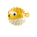 Green fish-shaped dog toy with textured surface for teeth cleaning and treat dispensing