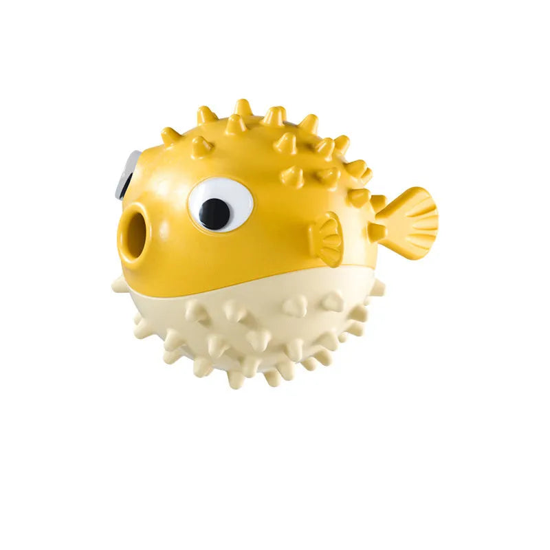 Green fish-shaped dog toy with textured surface for teeth cleaning and treat dispensing