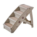 Foldable plastic pet step for small dogs and cats on a carpet next to a sofa.