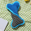 Blue plush teddy bear dog chew toy with a squeaker bone, for small to medium dogs.