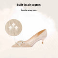 Champagne Gold pointed-toe high heel pumps with rhinestone and sequin decorations on a stiletto heel.