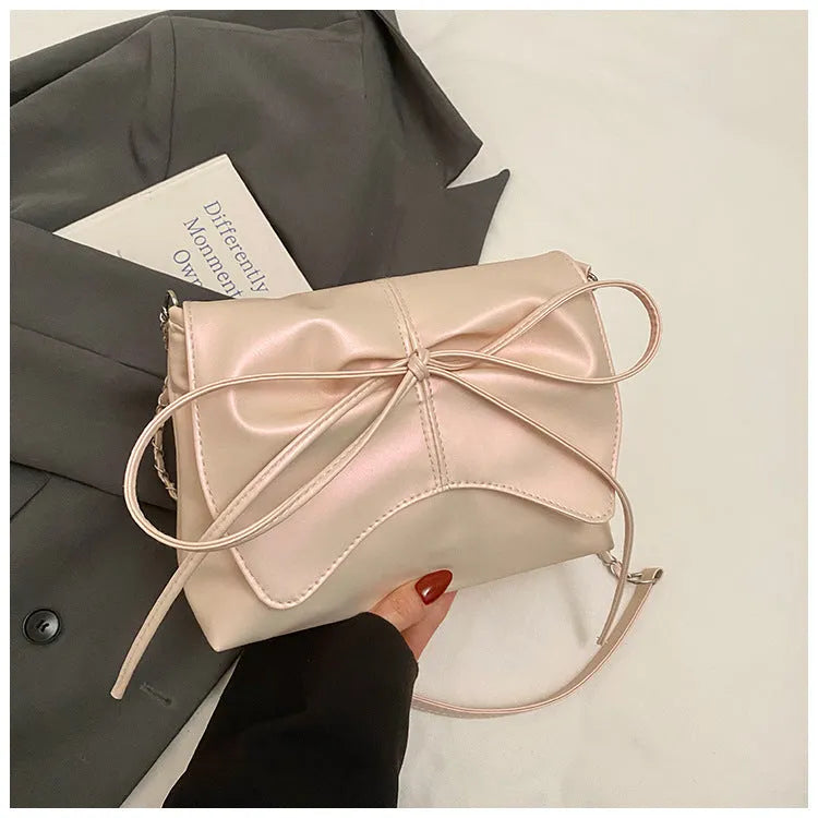 Women's black PU leather crossbody bag with square shape and sewing line detailing