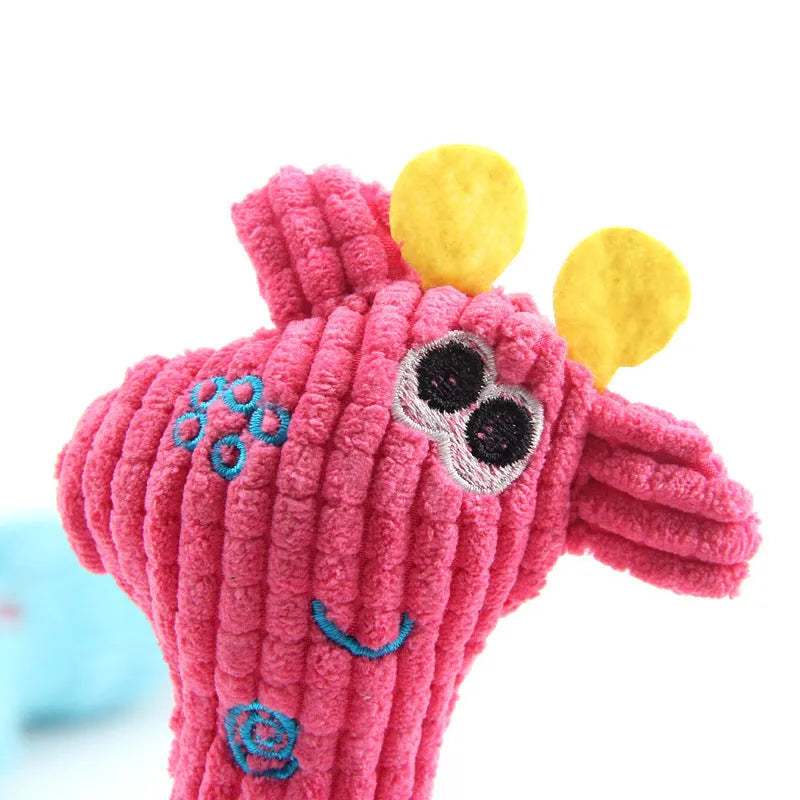Deer shaped plush dog toy with corn grain texture in blue, pink, and yellow colours