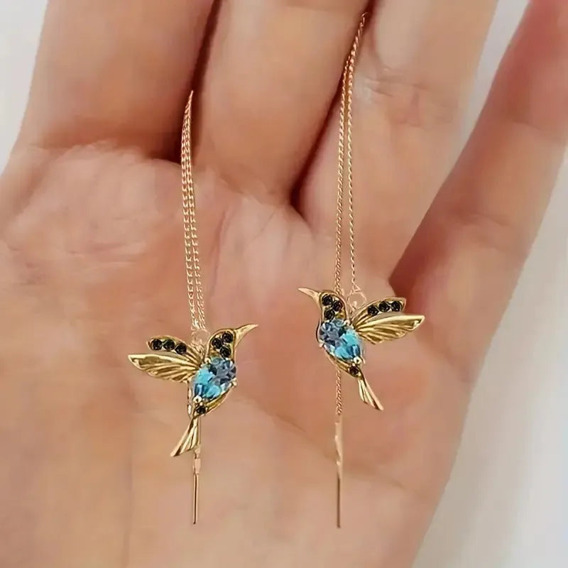Women's long style bird hanging dangle earrings with mixed zirconium wing details in alloy construction