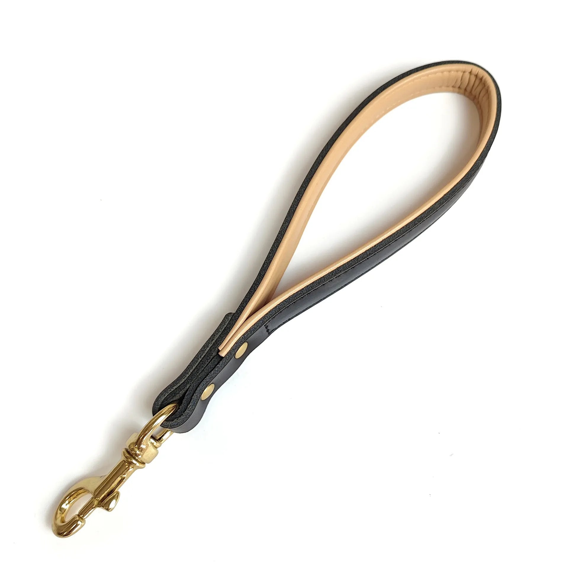 Black leather dog hand holding rope 30x2cm on surface