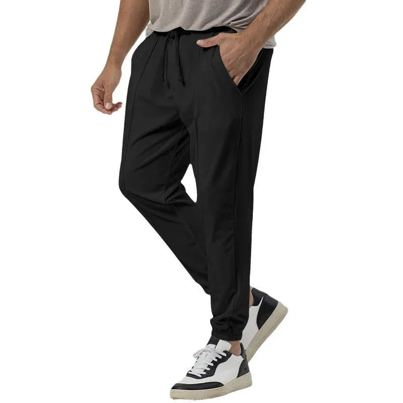 Men's straight-leg casual trousers in grey with tapered fit and elastic waistband