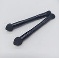Double-headed makeup brush with black miter sponge and artificial fibre bristles on wooden handle