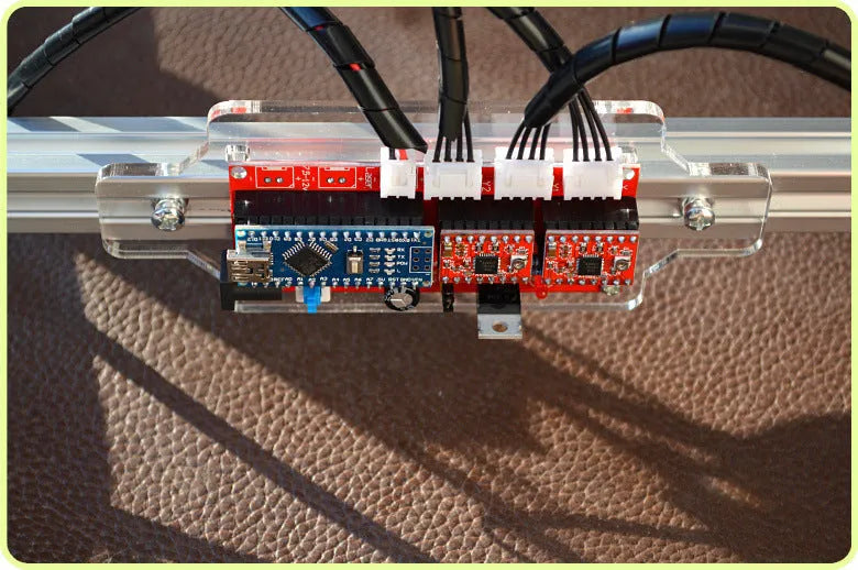 Miniature desktop laser engraving machine with 400mm by 300mm base plate for marking and lettering.