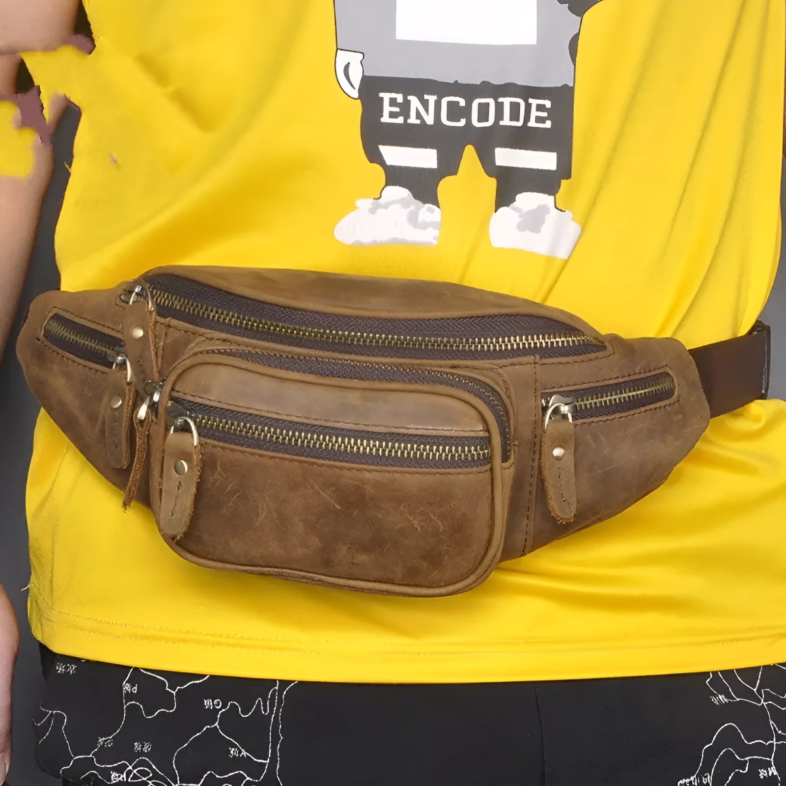 Brown leather retro messenger bag with a single shoulder strap shown open