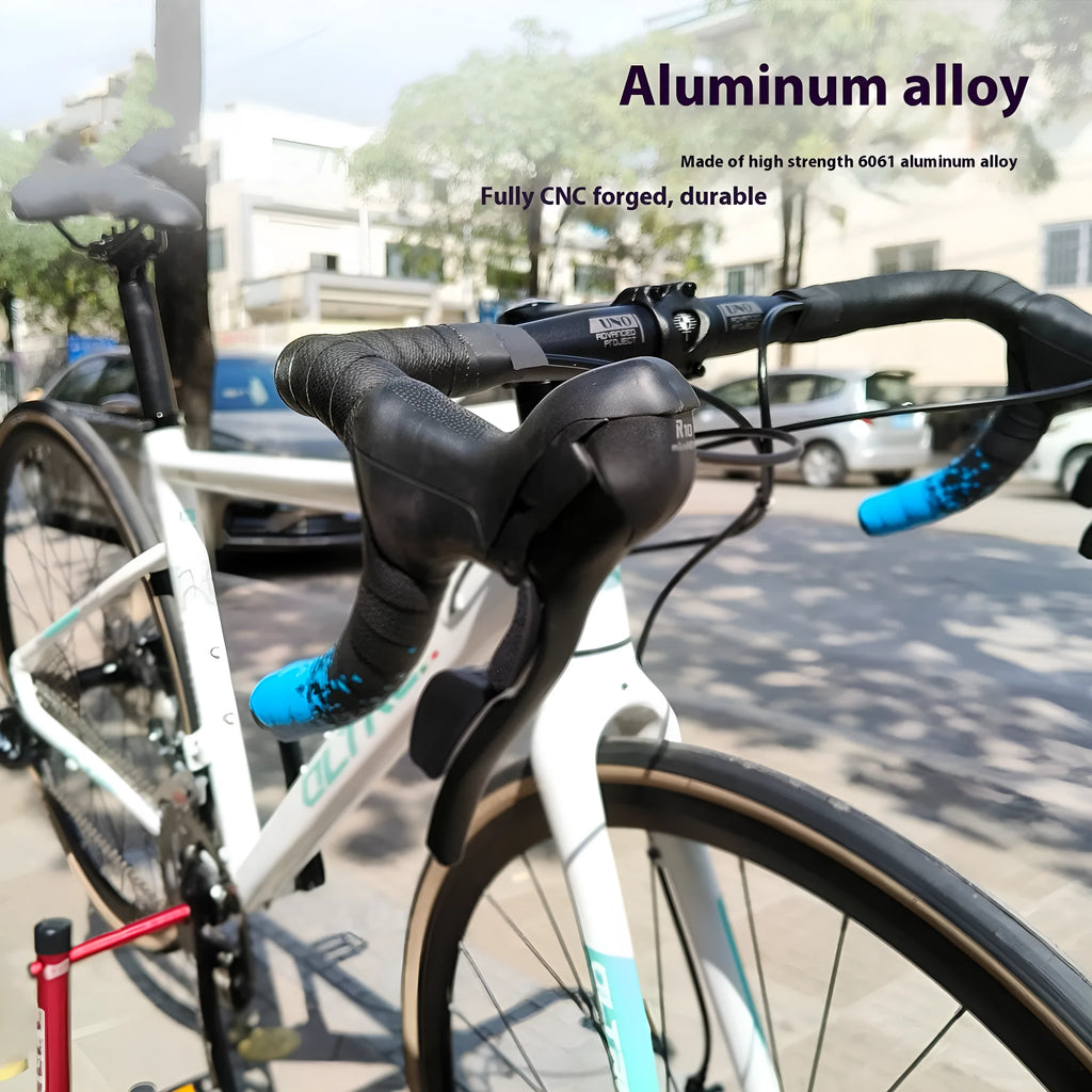 Black aluminium alloy road bike drop handlebar showing bend profile and UNO printing marks.